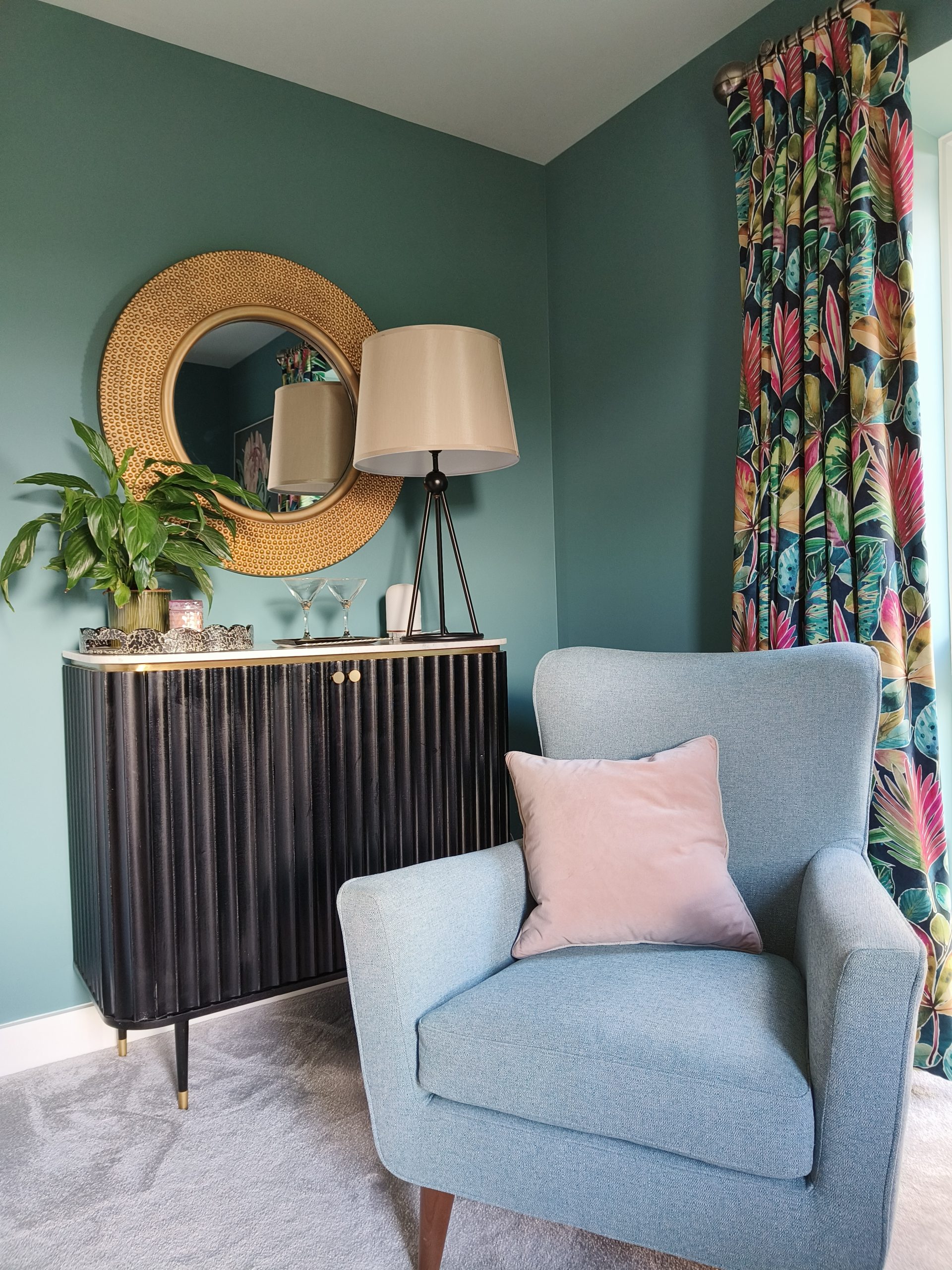 Black drinks cabinet and blue chair