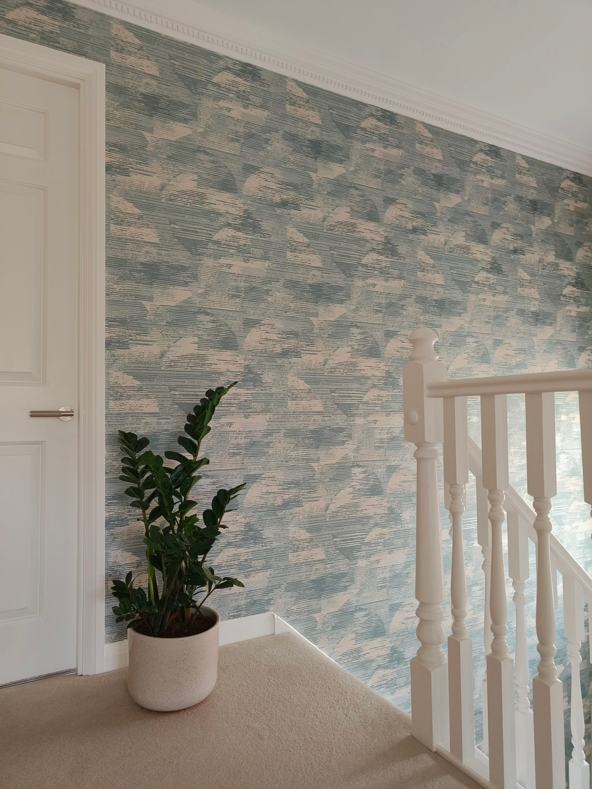 Textured blue wallpaper in calming hallway