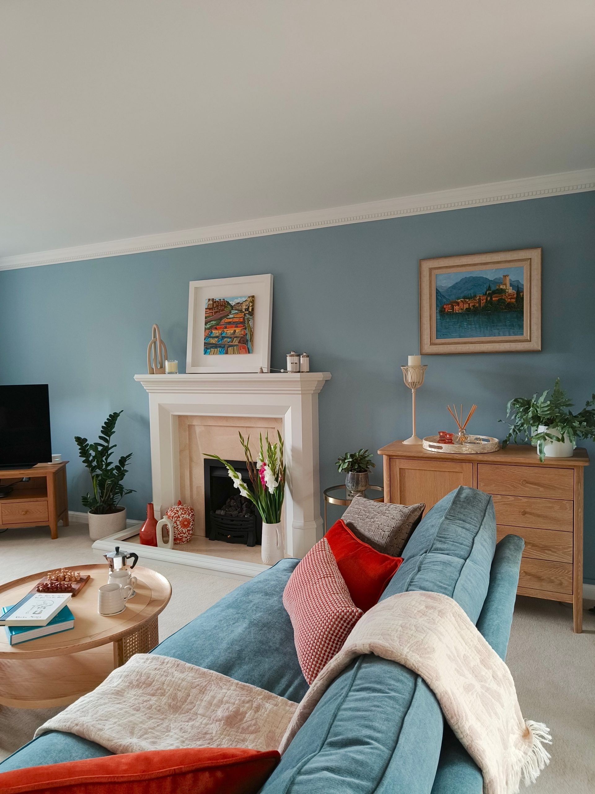 Calming modern blue living room with pale oak scandi furniture