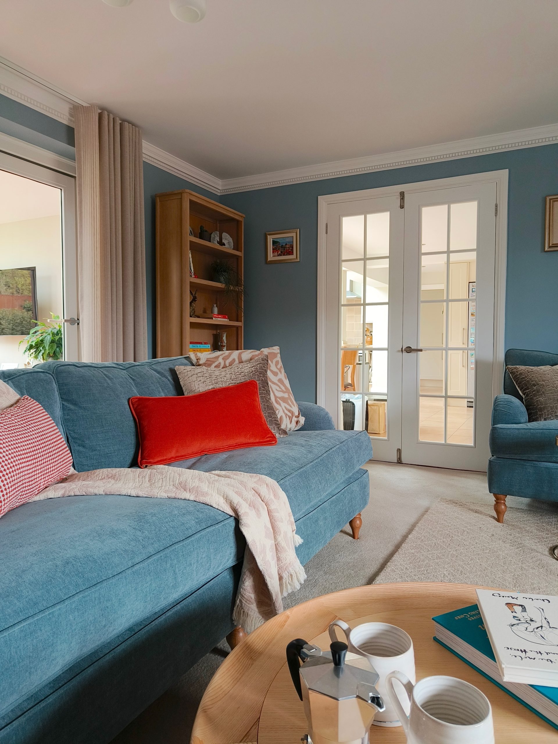 Calming modern blue living room with pale oak scandi furniture