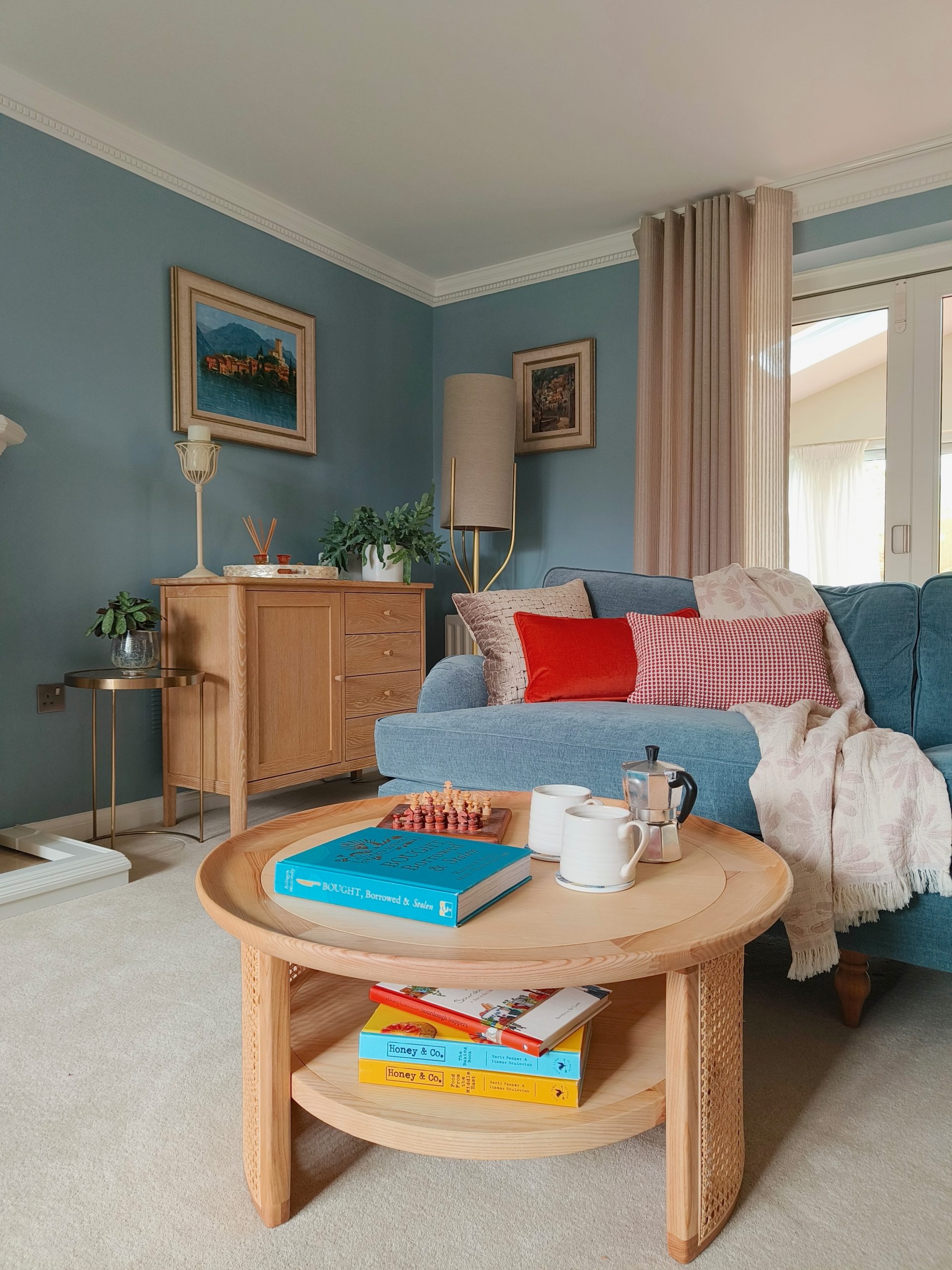 Calming modern blue living room with pale oak scandi furniture