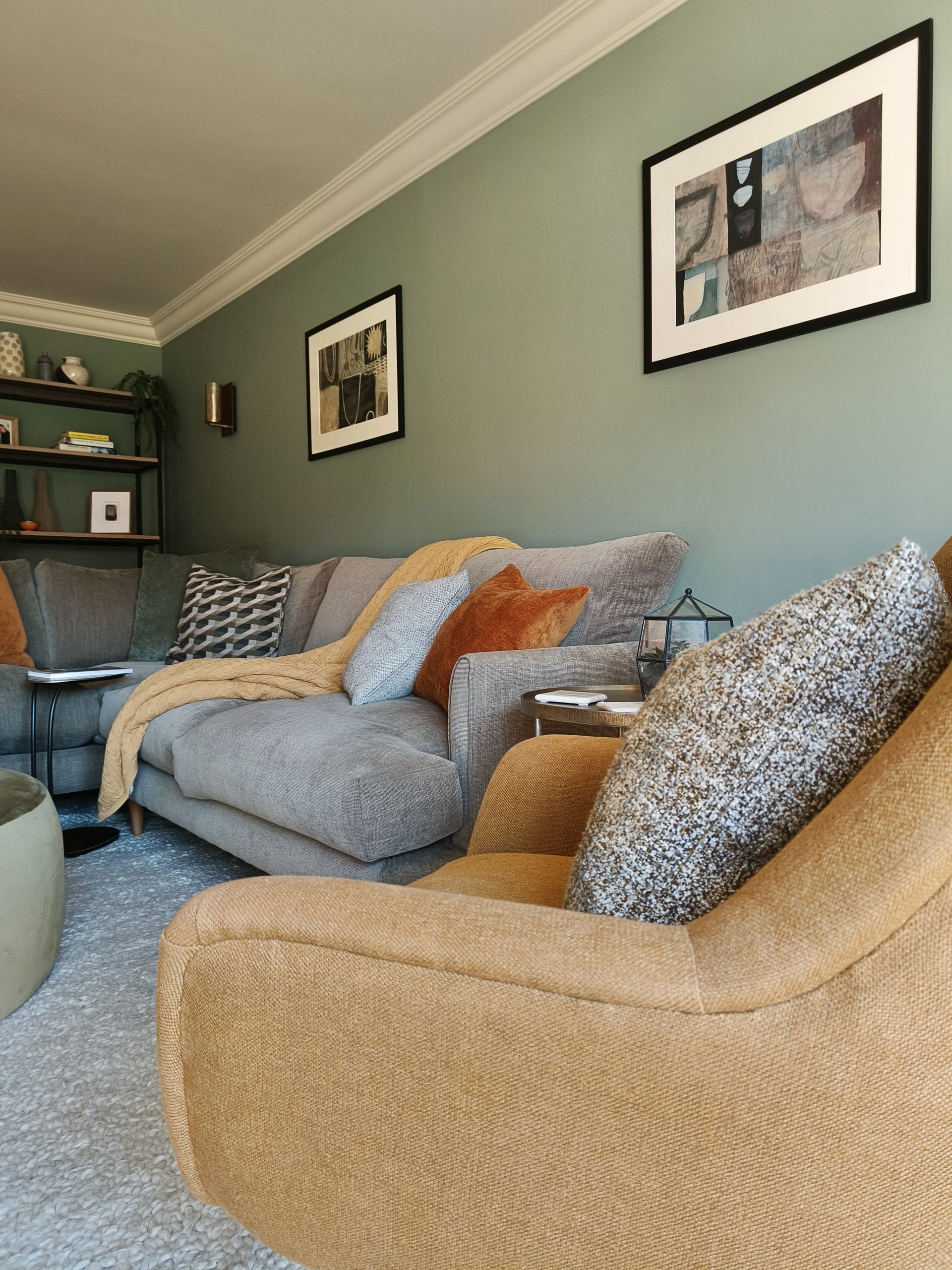 Olive green modern living room with ochre and black accents