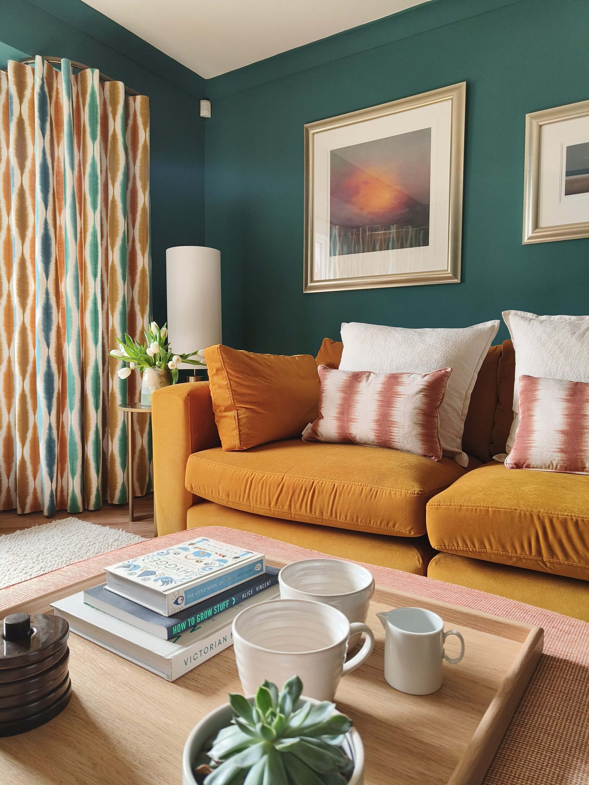 Scion curtains next to mustard sofa