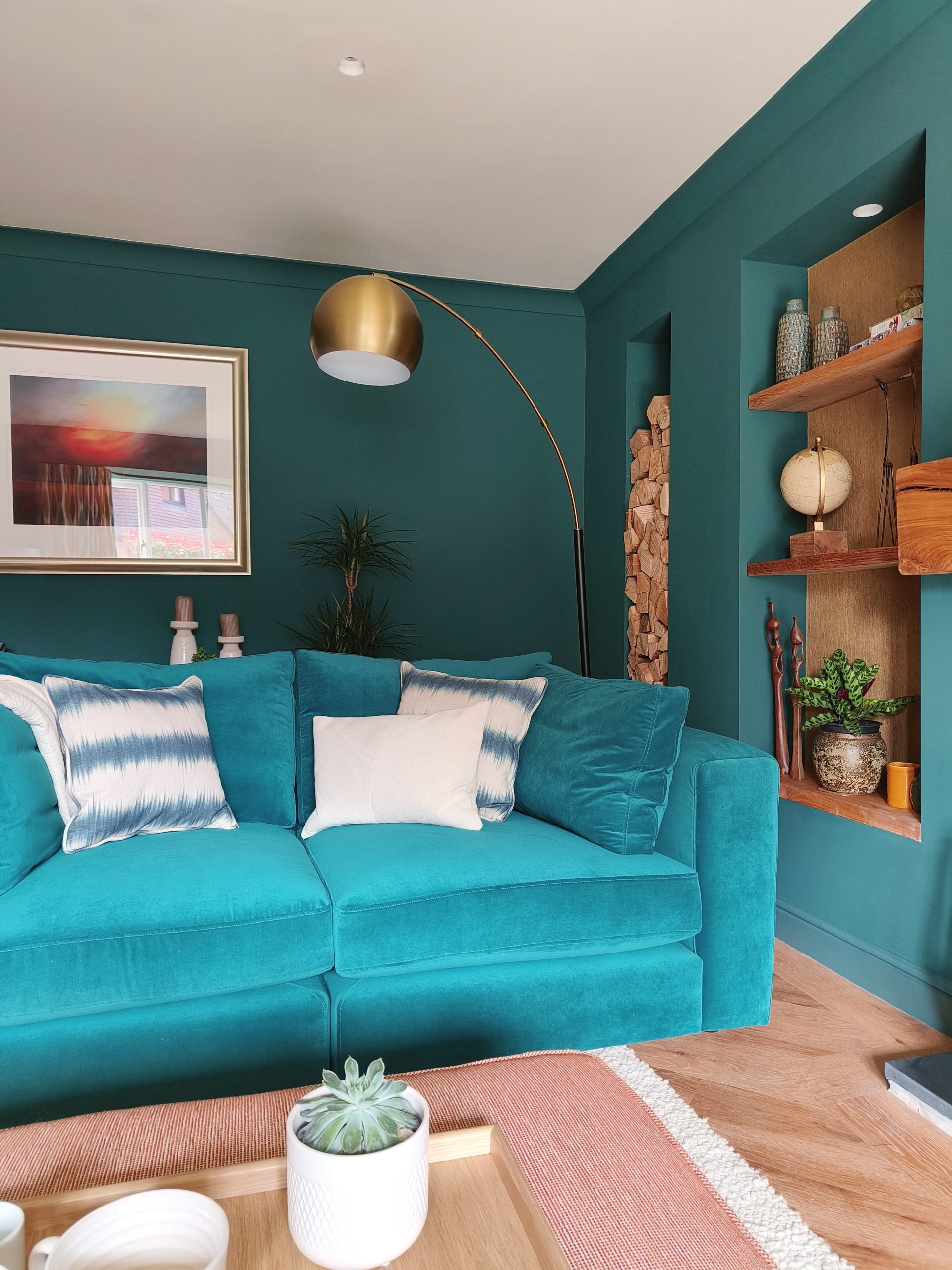 Teal sofa in teal living room with oak accents