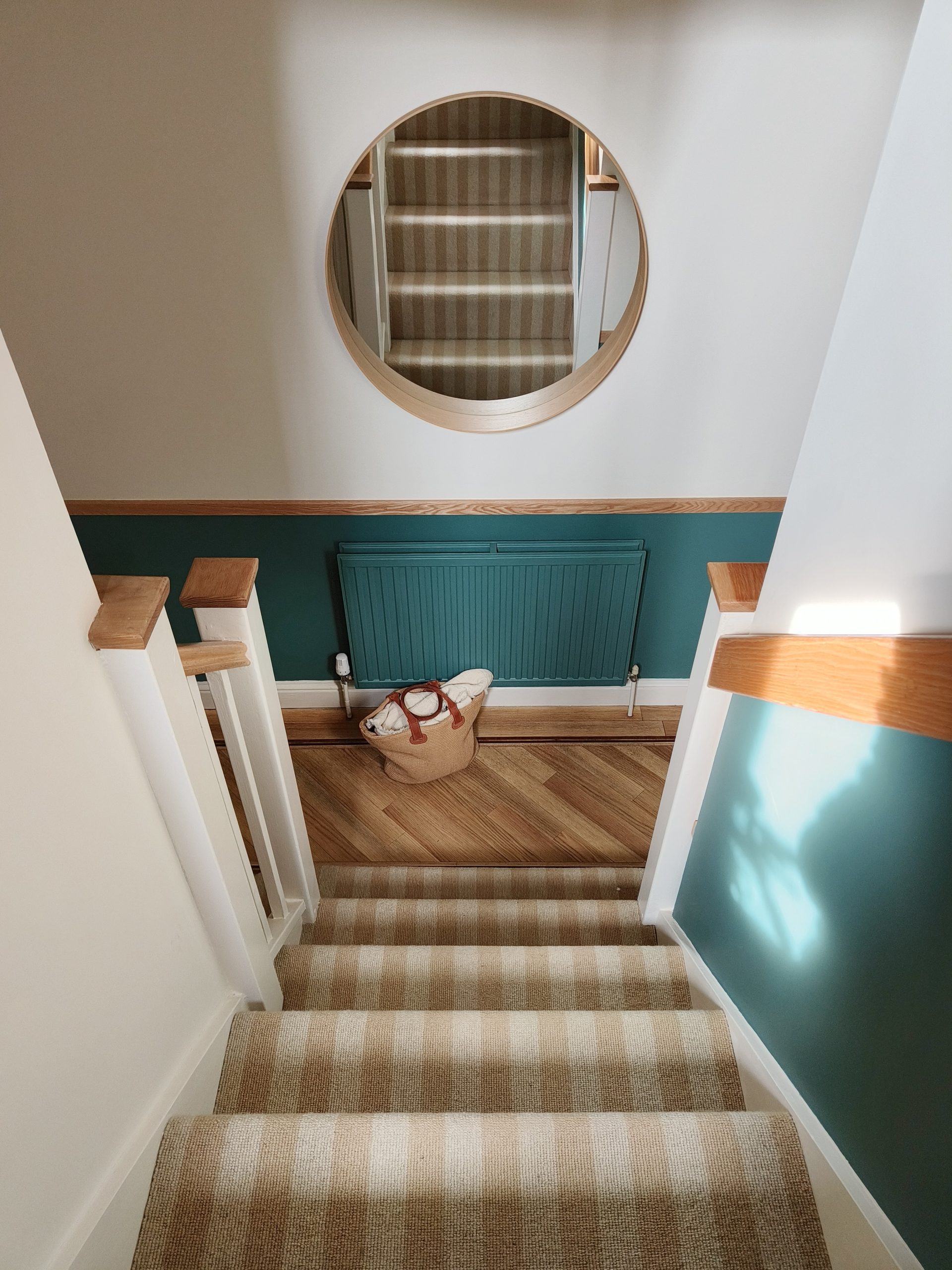 Teal & oak hallway looking down stairs